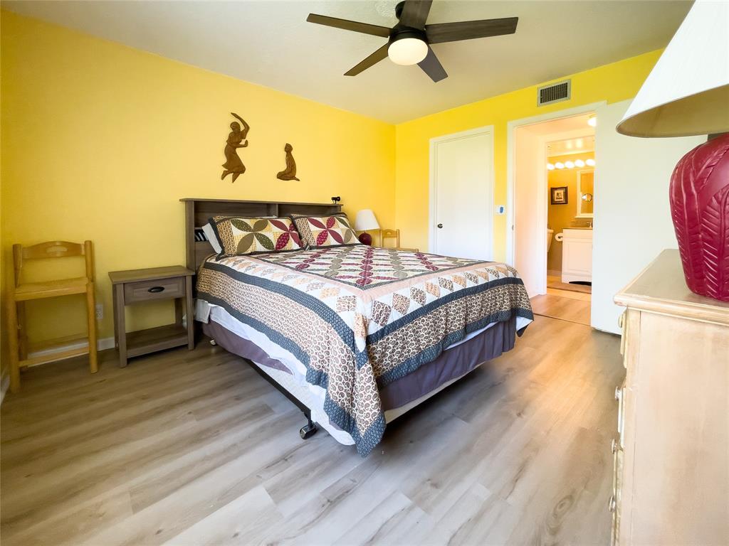 330 Knotty Pine Circle, Unit A1 Greenacres, FL 33463 - Photo 1 of 30 a bed sitting in a spacious bedroom next to a window