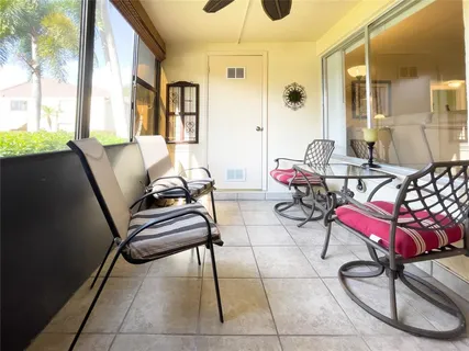 a outdoor space with lots of chairs and mirrors