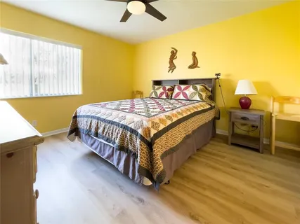 a bed sitting in a room next to a window