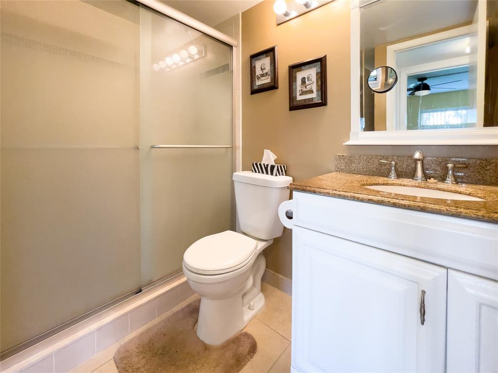330 Knotty Pine Circle, Unit A1 Greenacres, FL 33463 - Photo 16 of 30 a bathroom with a sink and a toilet