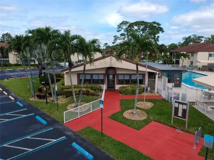 a view of a house with swimming pool and porch