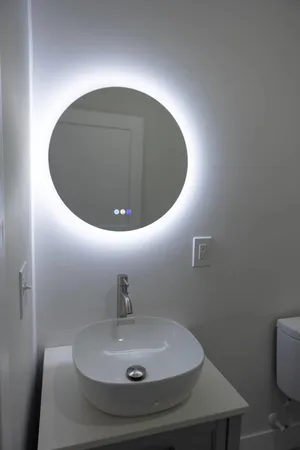 a bathroom with a sink and mirror
