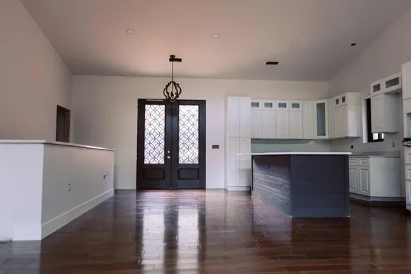 a view of a kitchen cabinets and a wooden floor