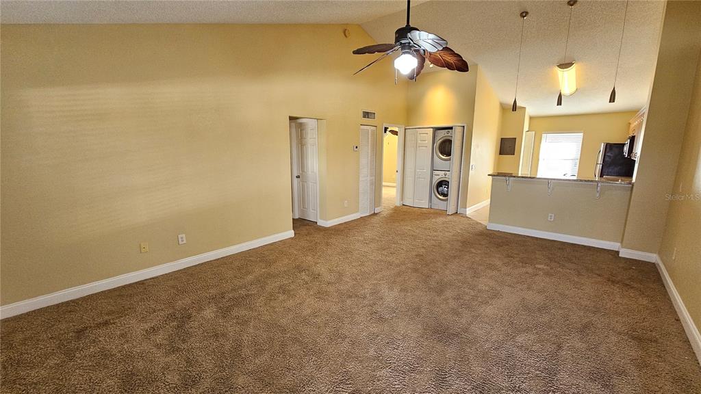 3651 North Goldenrod Road, Unit C205 Winter Park, FL 32792 - Photo 2 of 11 a view of a big room with a ceiling fan and a window