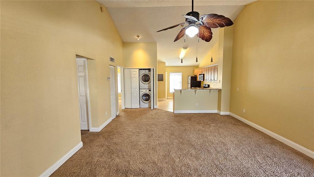 3651 North Goldenrod Road, Unit C205 Winter Park, FL 32792 - Photo 3 of 11 a view of a living room with a chandelier