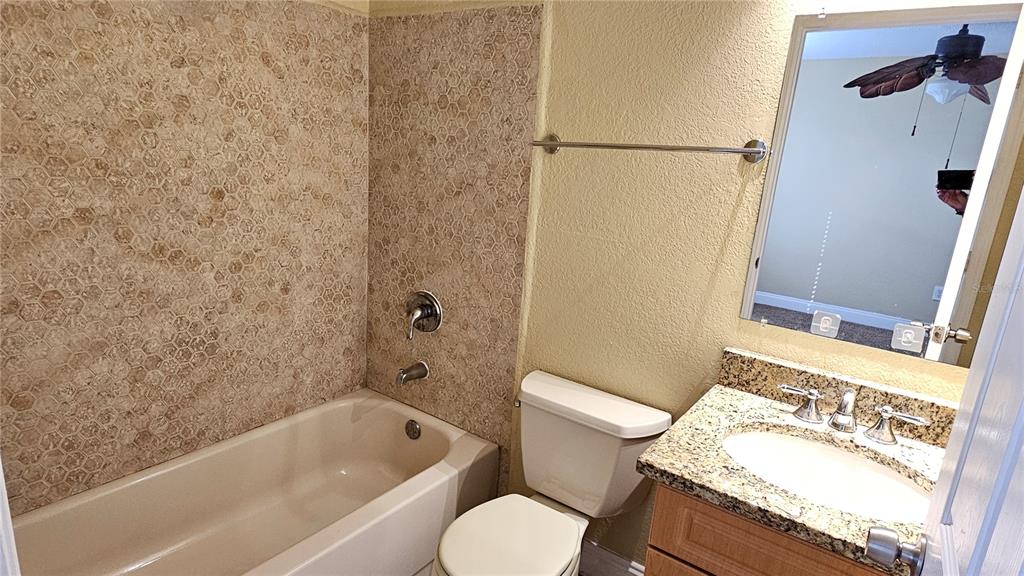 3651 North Goldenrod Road, Unit C205 Winter Park, FL 32792 - Photo 7 of 11 a bathroom with a sink toilet and shower