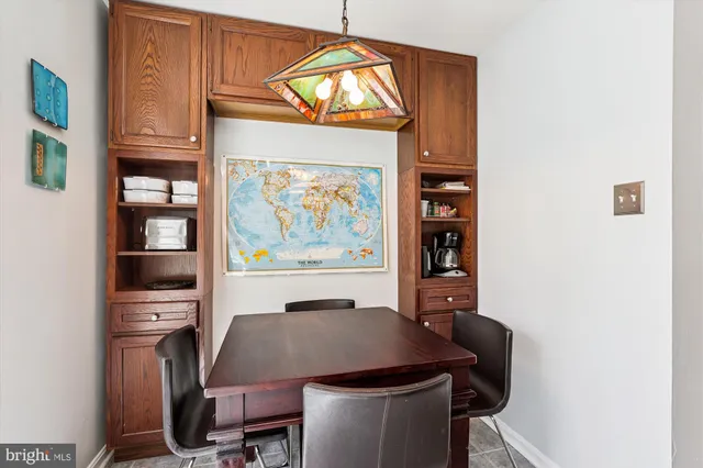 a bathroom with a sink vanity mirror and toilet