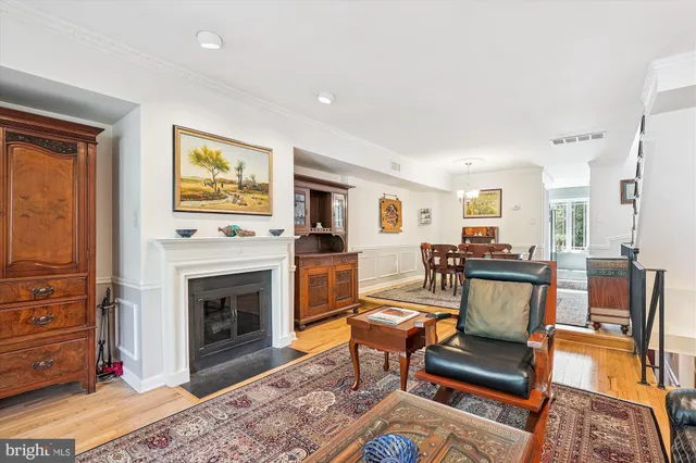 a bedroom with a bed a large window and chair