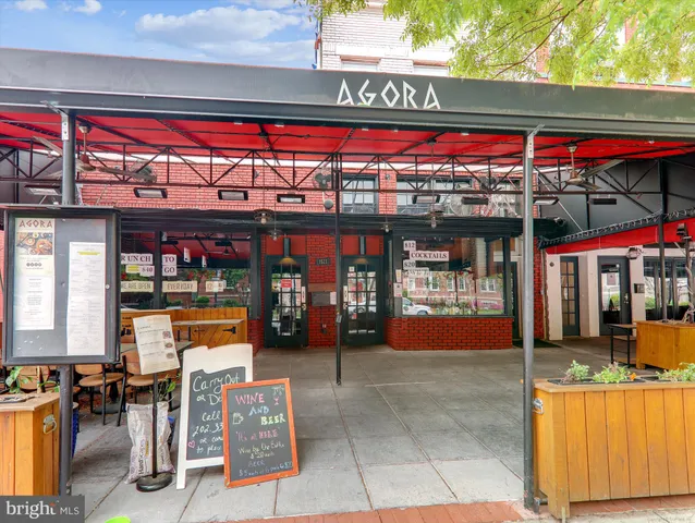 a view of a building with sitting area
