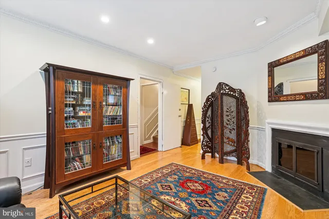 a living room with furniture fireplace and rug