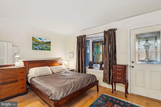 a bedroom with bed and window