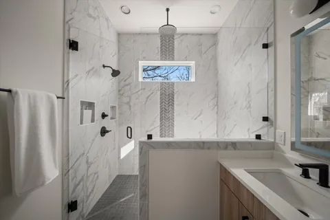 a bathroom with a sink toilet a bathtub and vanity