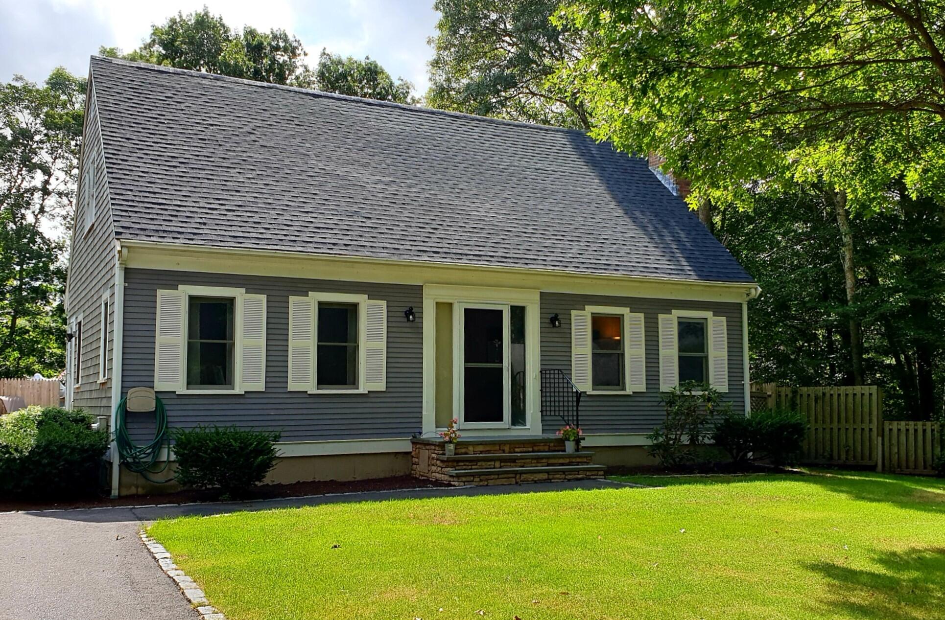a view of a house with a yard patio and a swimming pool