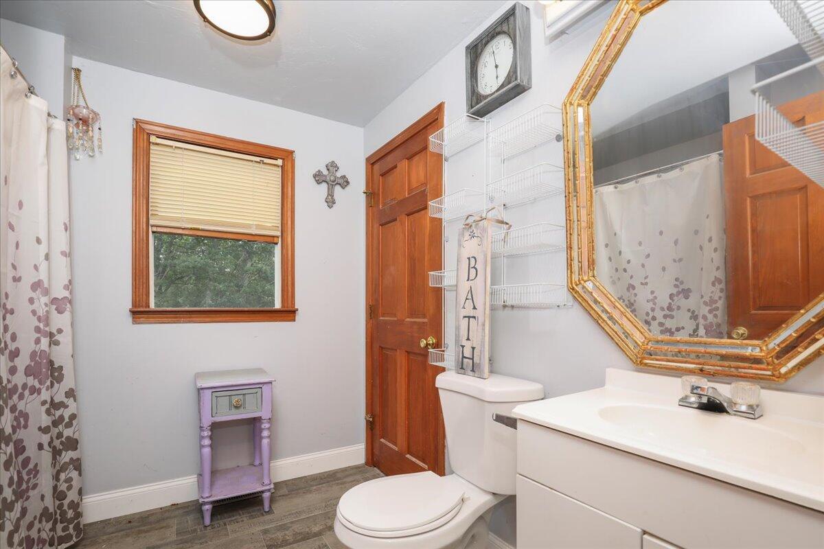 22 Dana Road Forestdale, MA 02644 - Photo 11 of 15 a bathroom with a sink a toilet and a mirror