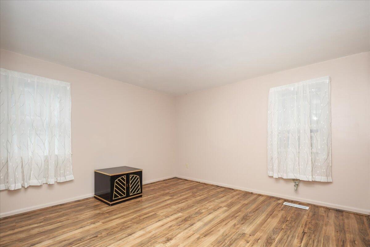 22 Dana Road Forestdale, MA 02644 - Photo 6 of 15 a view of empty room with wooden floor and fan