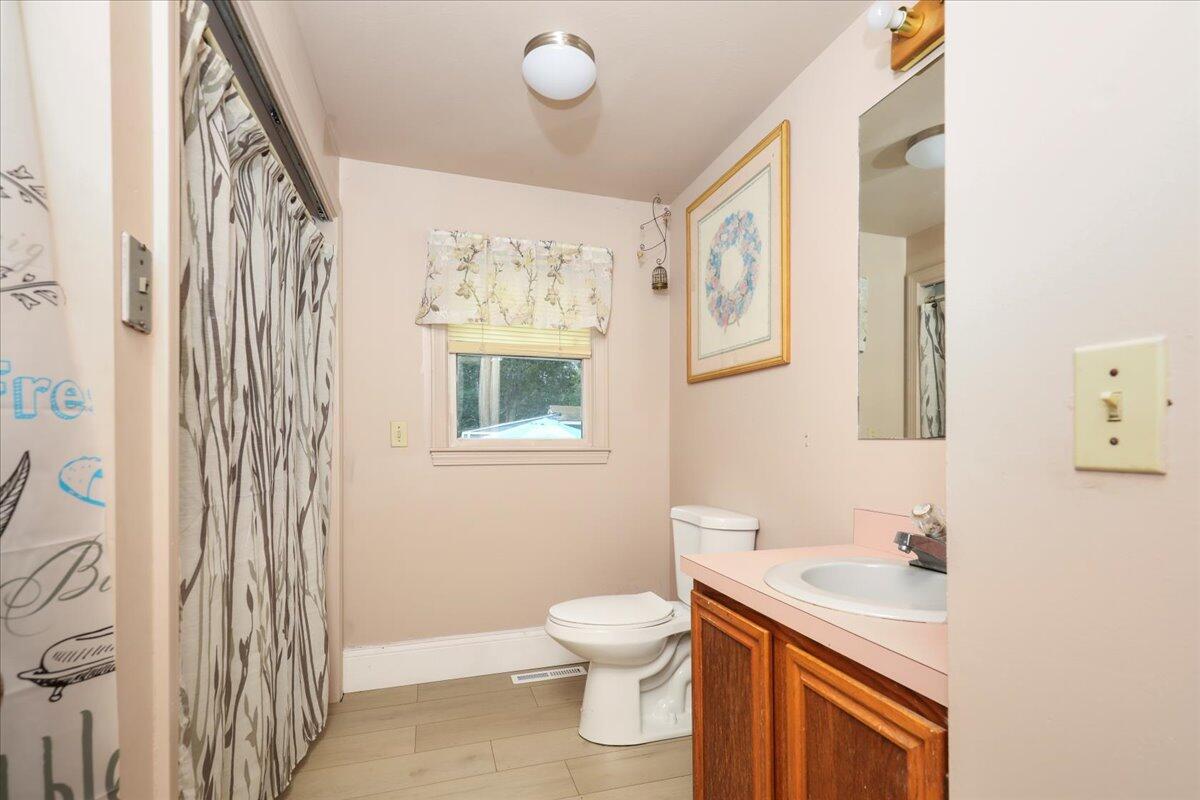 22 Dana Road Forestdale, MA 02644 - Photo 7 of 15 a bathroom with a sink a toilet and a window