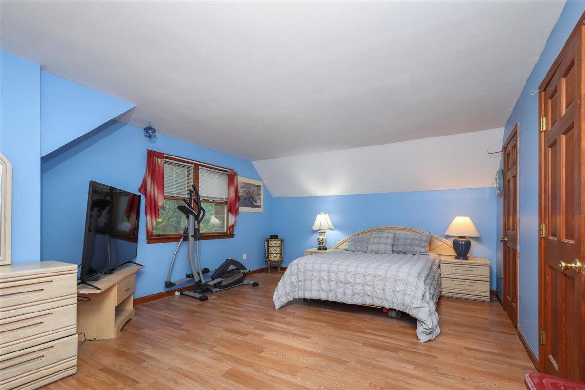 22 Dana Road Forestdale, MA 02644 - Photo 9 of 15 a bedroom with furniture and a wooden floor