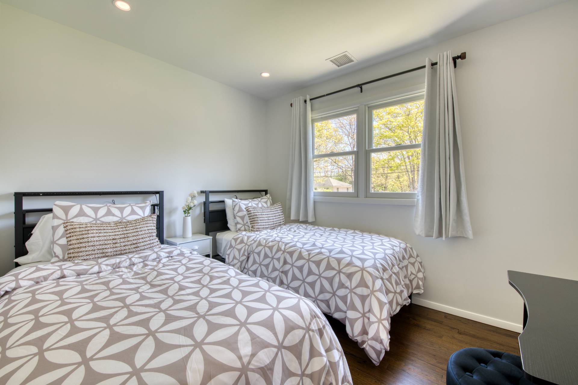 88 Old Country Road East Quogue, NY 11942 - Photo 8 of 10 a bedroom with two beds and a window