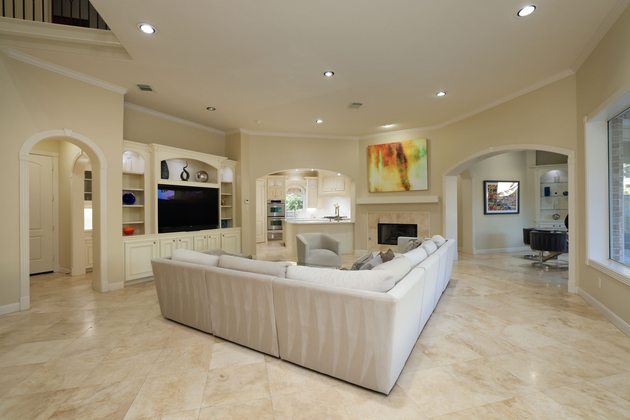 16610 Fern Rock Falls Court Spring, TX 77379 - Photo 10 of 49 a living room with furniture a flat screen tv and a fireplace