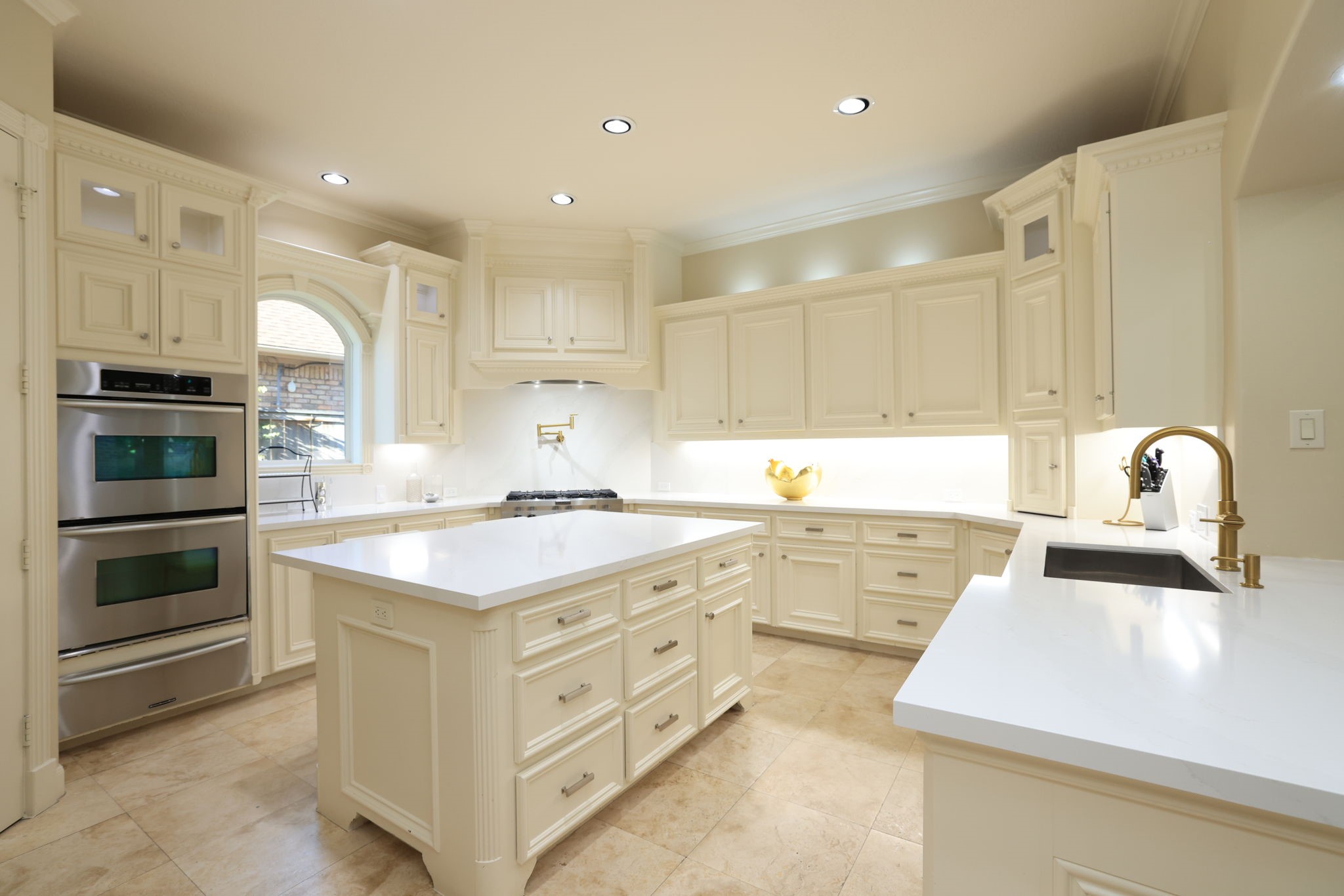 16610 Fern Rock Falls Court Spring, TX 77379 - Photo 15 of 49 a kitchen with kitchen island white cabinets and stainless steel appliances