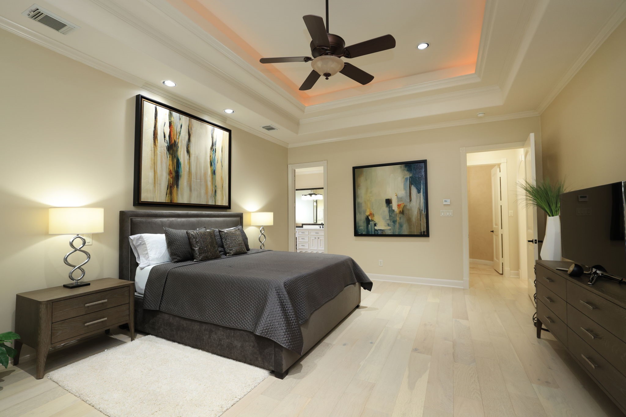 16610 Fern Rock Falls Court Spring, TX 77379 - Photo 22 of 49 a bedroom with a large bed and a flat tv screen