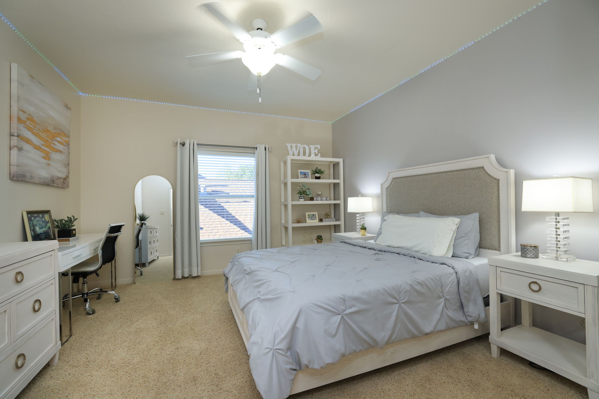 16610 Fern Rock Falls Court Spring, TX 77379 - Photo 36 of 49 a bedroom with a bed and a chandelier fan