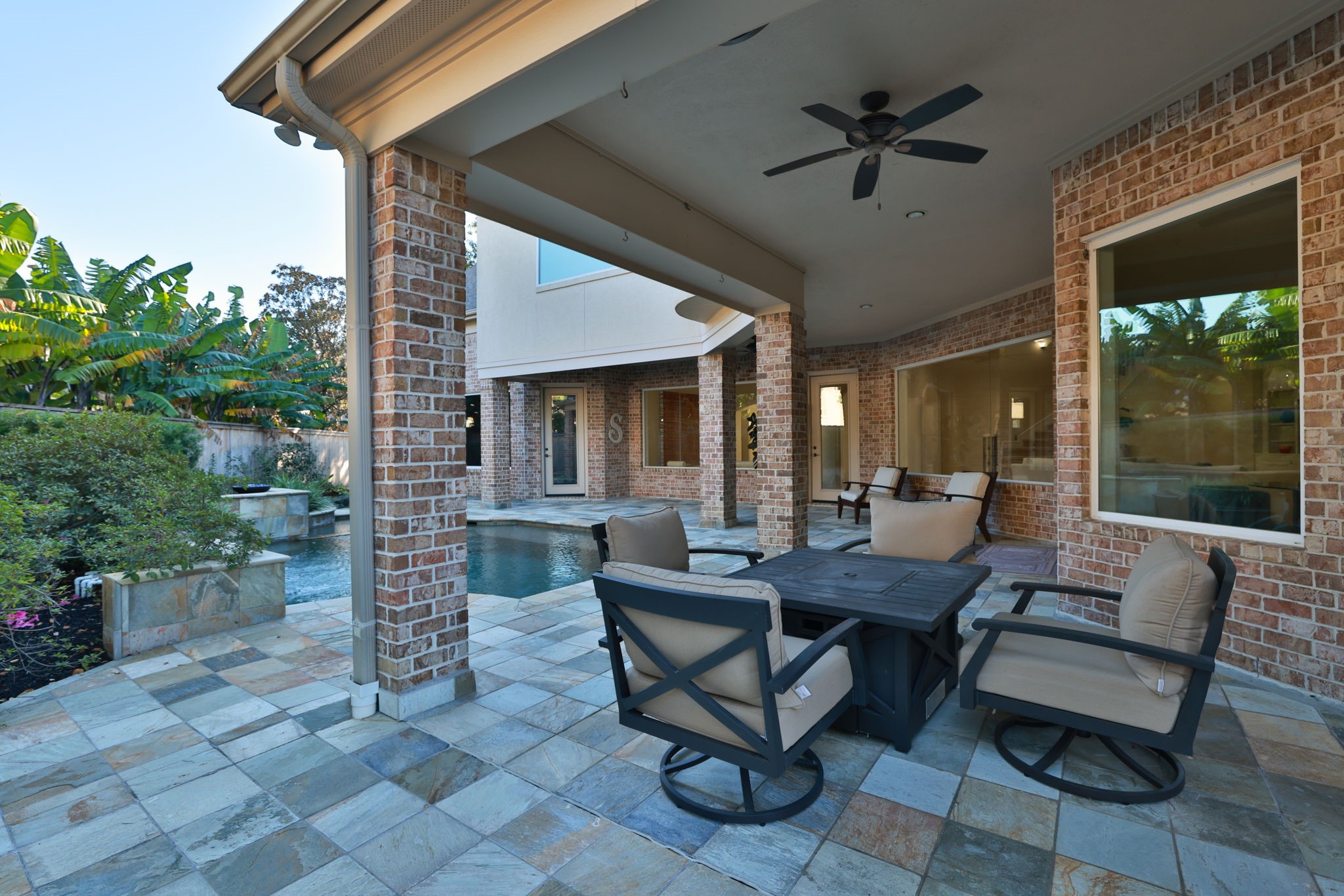 16610 Fern Rock Falls Court Spring, TX 77379 - Photo 42 of 49 a outdoor space with patio the couches and a potted plant with the view of garden