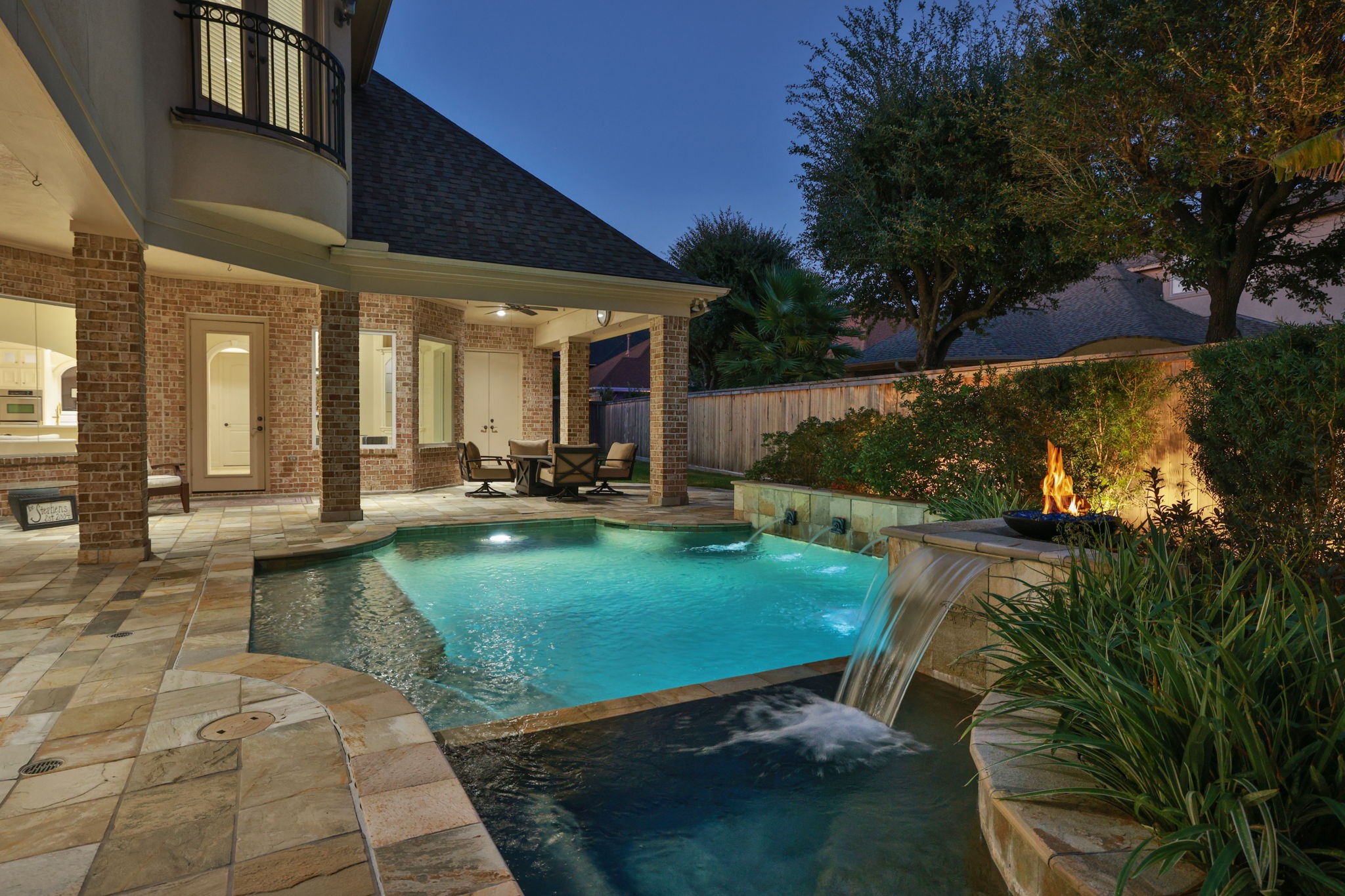 16610 Fern Rock Falls Court Spring, TX 77379 - Photo 46 of 49 a view of a swimming pool with lawn chairs under an umbrella