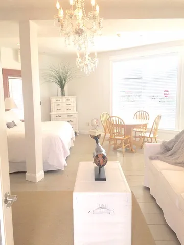 a bedroom with furniture and a large mirror