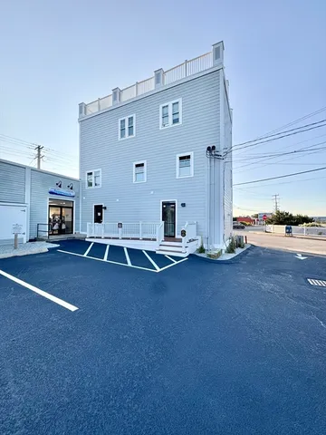a view of kitchen with two windows and a fireplace