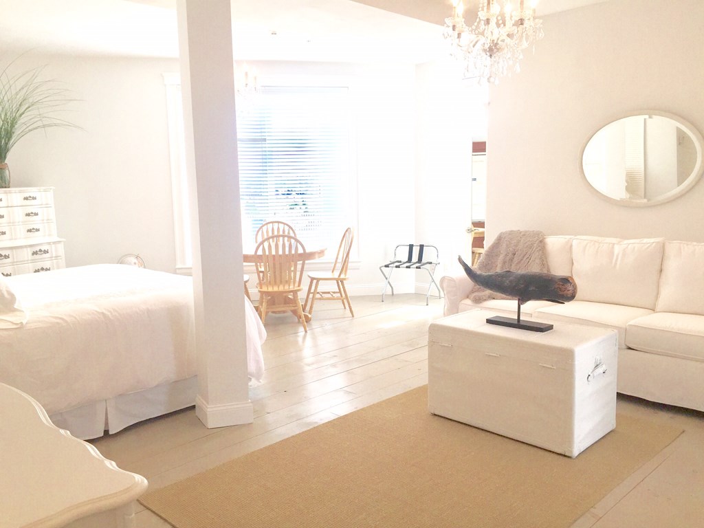 4 Bay Street, Unit A0 Hull, MA 02045 - Photo 2 of 23 a living room with furniture and a large window