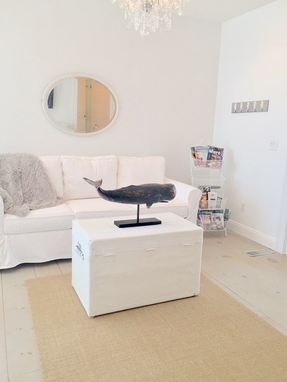 4 Bay Street, Unit A0 Hull, MA 02045 - Photo 3 of 23 a living room with furniture and a couch