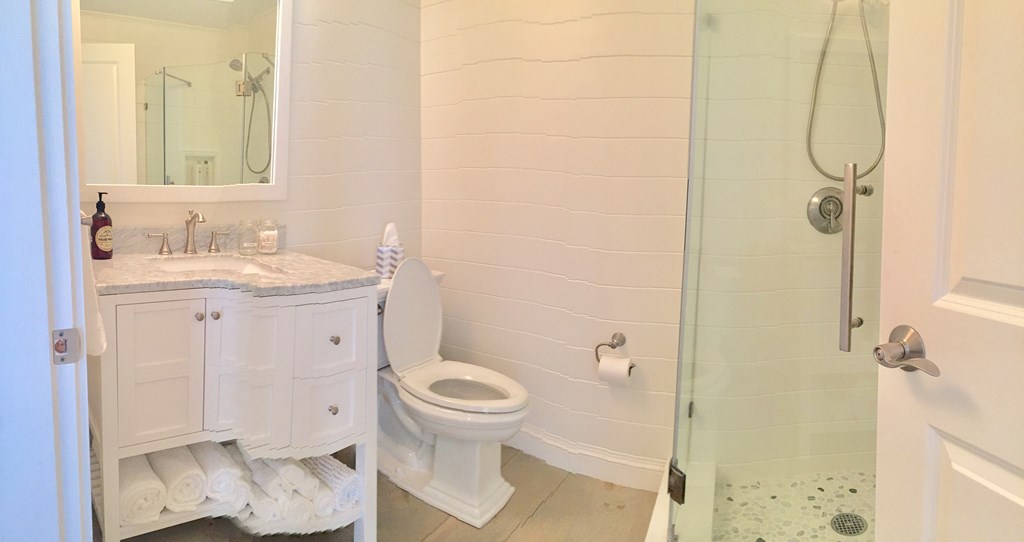 4 Bay Street, Unit A0 Hull, MA 02045 - Photo 7 of 23 a bathroom with a sink toilet and shower