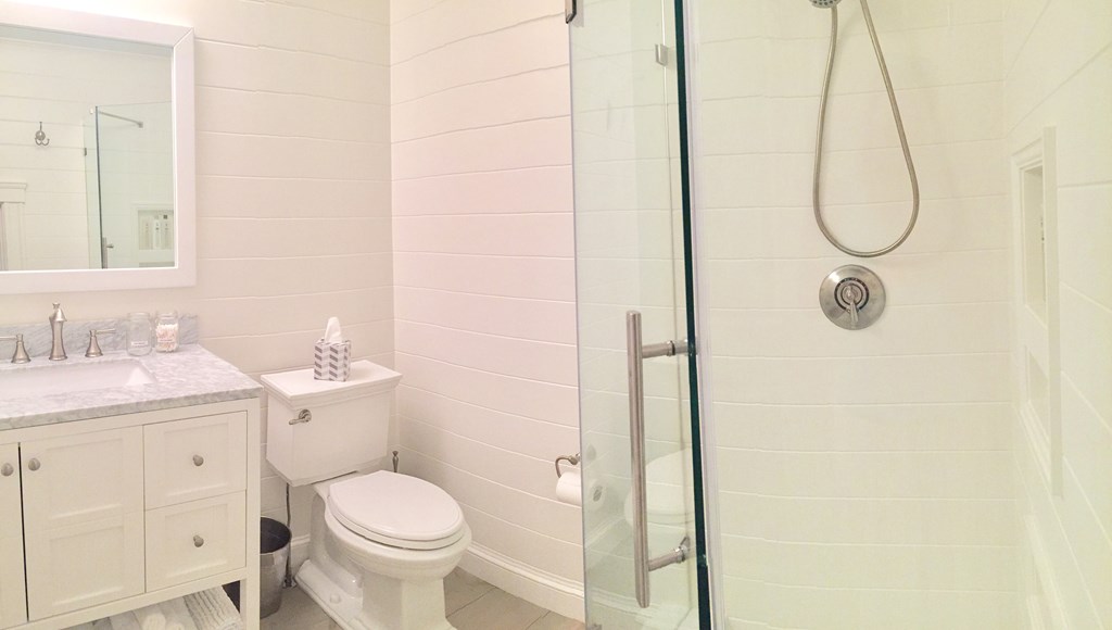 4 Bay Street, Unit A0 Hull, MA 02045 - Photo 9 of 23 a bathroom with a granite countertop sink toilet and shower
