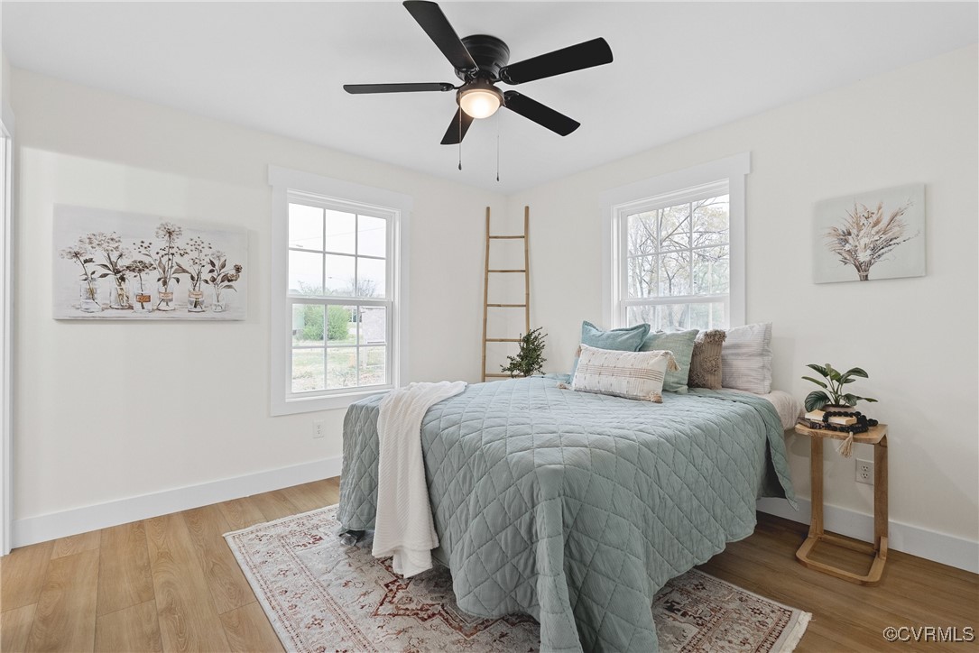 26428 Dejarnette Lane Ruther Glen, VA 22546 - Photo 14 of 27 a bedroom with a bed and a window