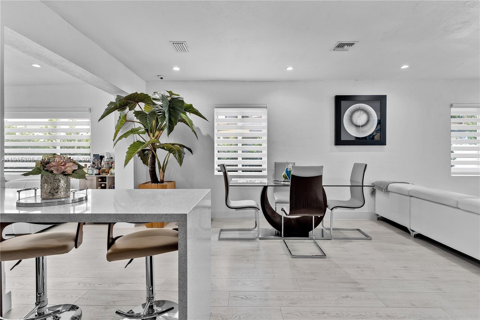 444 Southwest 64th Avenue Miami, FL 33144 - Photo 12 of 70 a living room with furniture and a potted plant