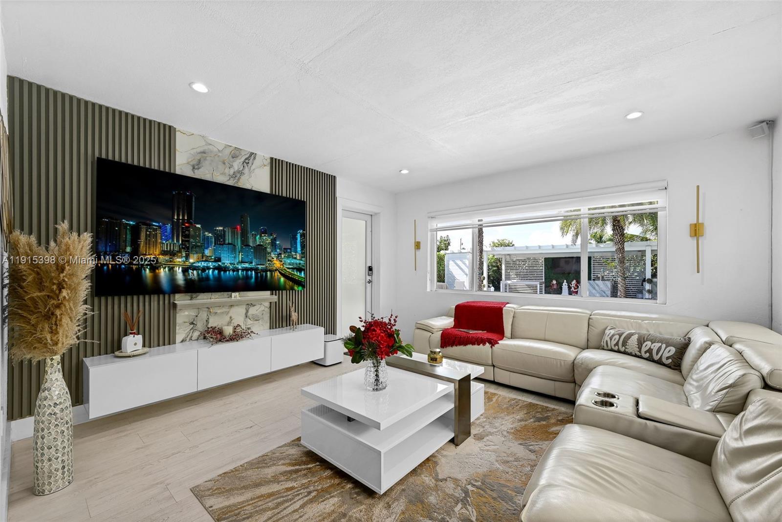 444 Southwest 64th Avenue Miami, FL 33144 - Photo 13 of 70 a living room with furniture and a flat screen tv