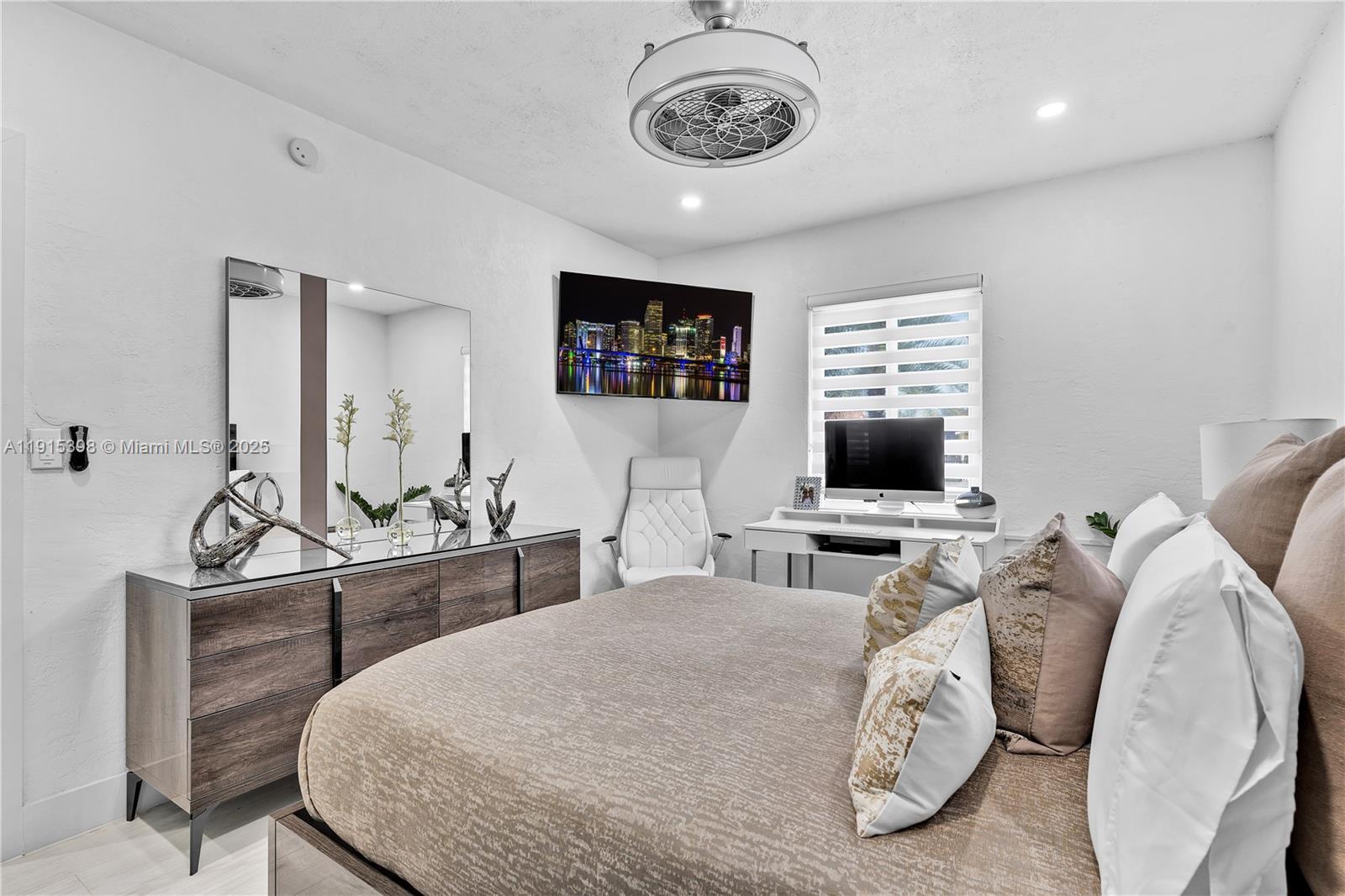 444 Southwest 64th Avenue Miami, FL 33144 - Photo 18 of 70 a living room with furniture a flat screen tv and a fireplace