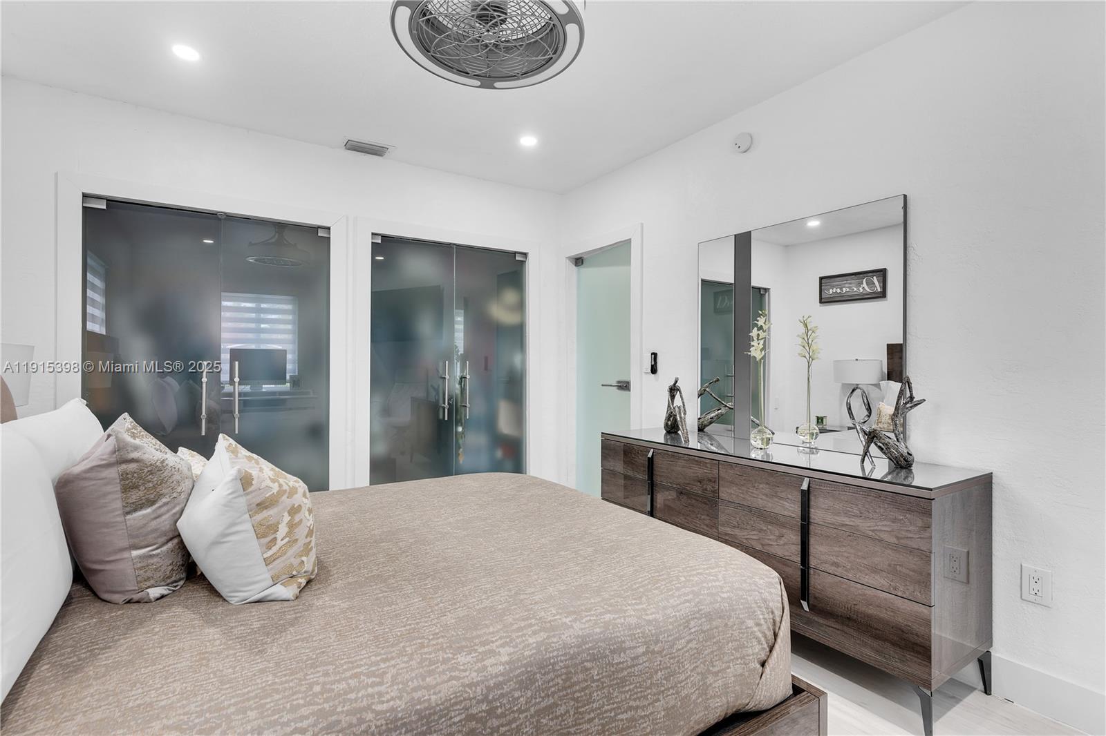 444 Southwest 64th Avenue Miami, FL 33144 - Photo 19 of 70 a bedroom with a bed and a large mirror