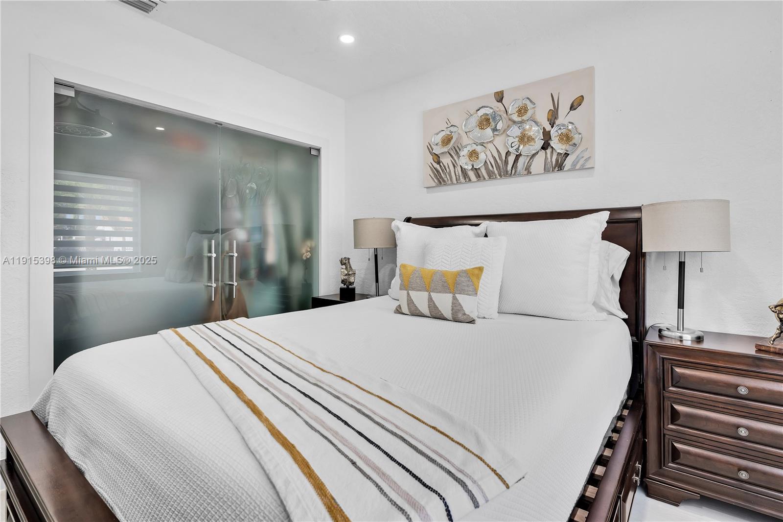 444 Southwest 64th Avenue Miami, FL 33144 - Photo 21 of 70 a bedroom with a bed and a painting on the wall