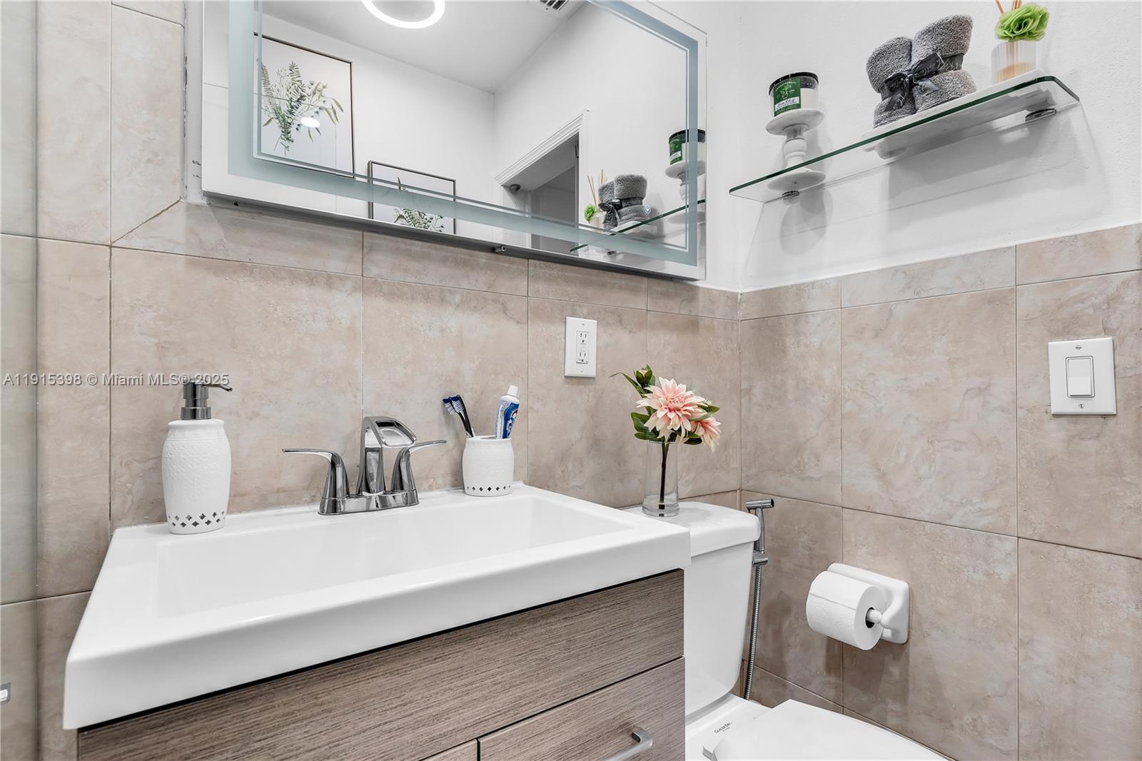 444 Southwest 64th Avenue Miami, FL 33144 - Photo 23 of 70 a bathroom with a sink and a toilet