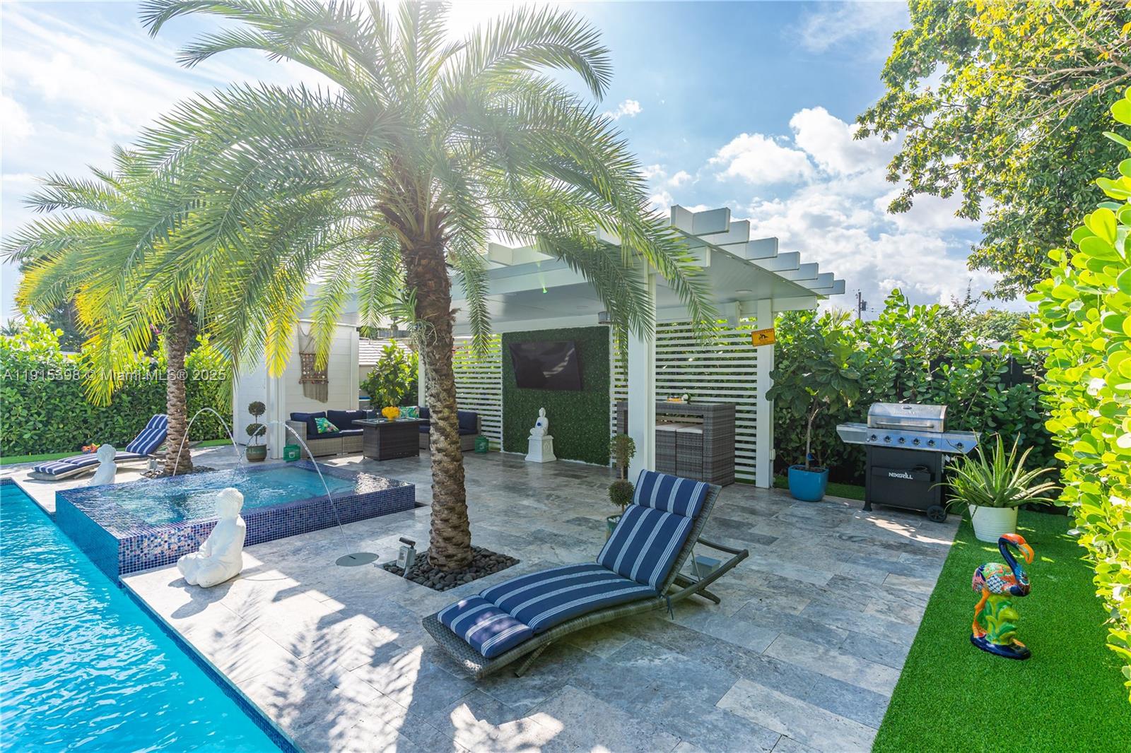 444 Southwest 64th Avenue Miami, FL 33144 - Photo 35 of 70 a view of a patio with table and chairs potted plants and large tree