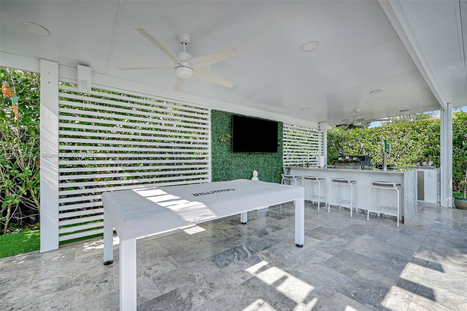 444 Southwest 64th Avenue Miami, FL 33144 - Photo 45 of 70 a view of a patio with table and chairs with wooden floor and plants