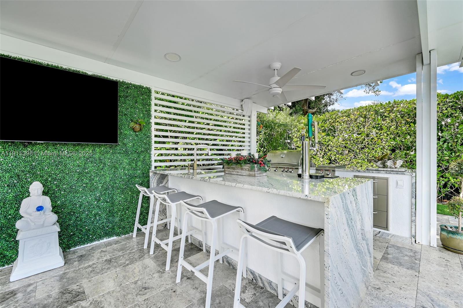 444 Southwest 64th Avenue Miami, FL 33144 - Photo 46 of 70 a patio with table and chairs and potted plants