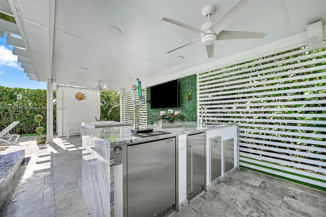 an aerial view of residential houses with outdoor space and swimming pool