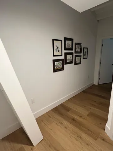 a kitchen with stainless steel appliances a sink a stove a microwave a sink a refrigerator and cabinets