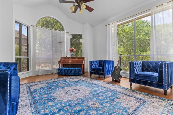 a living room with furniture and a large window