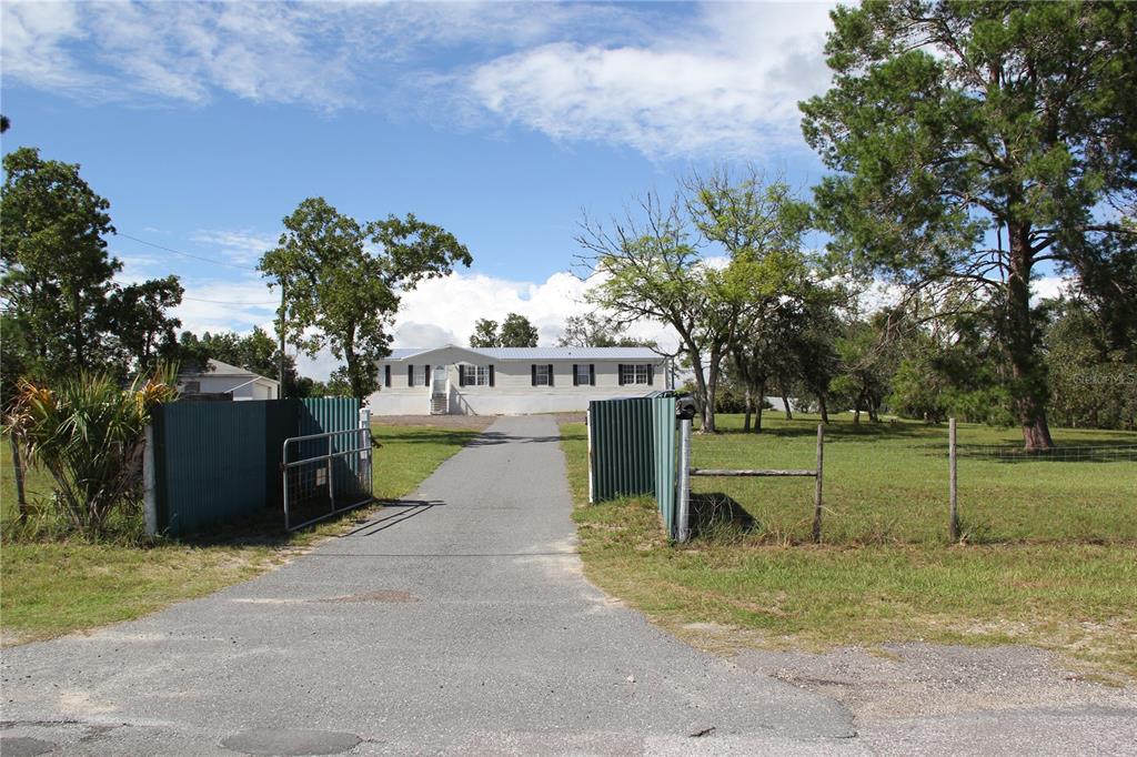 13127 Star Road Brooksville, FL 34613 - Photo 27 of 54 a view of outdoor space yard and entertaining space