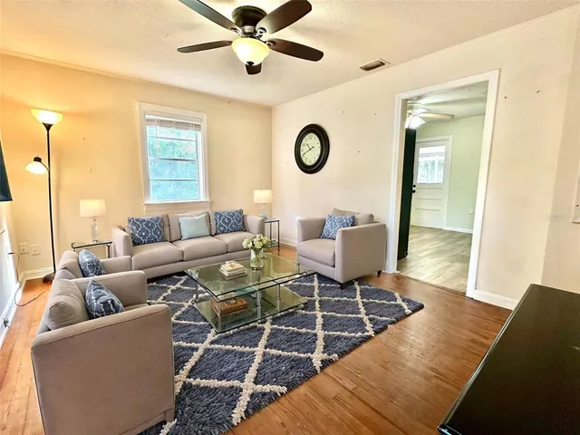 a living room with furniture and a window