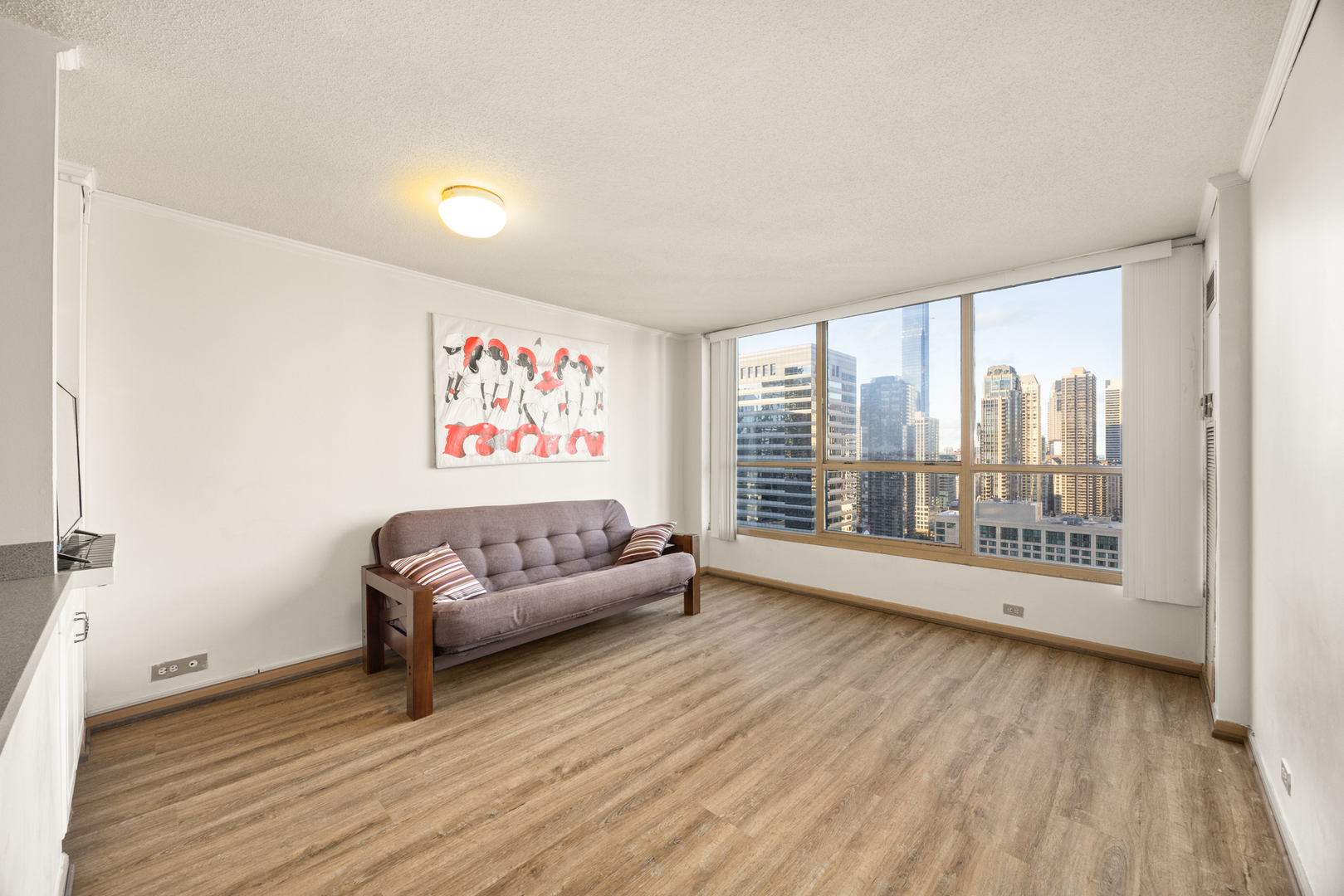 405 North Wabash Avenue, Unit 2801 Chicago, IL 60611 - Photo 18 of 29 a living room with furniture and a large window